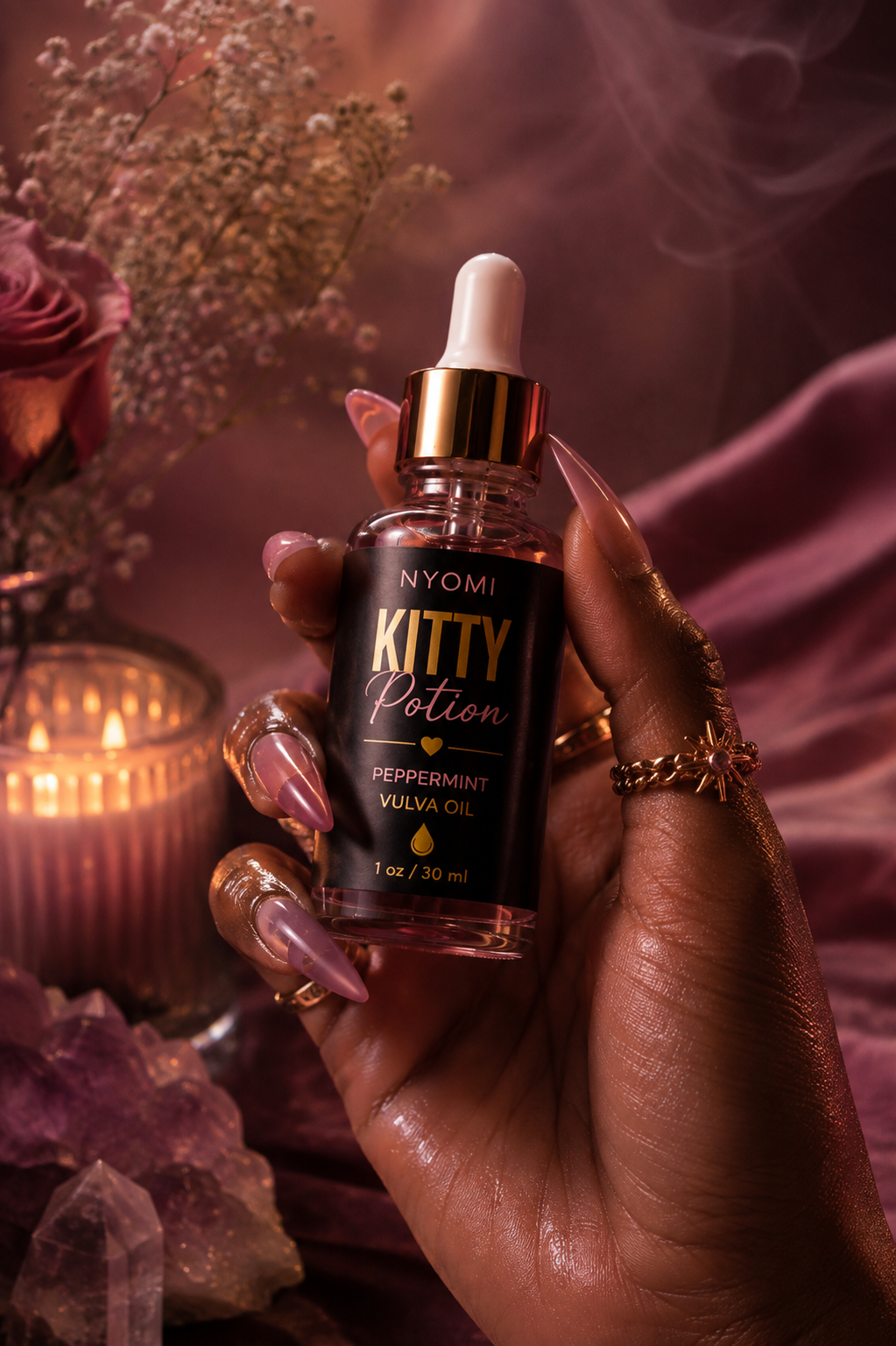 NYOMI Kitty Potion held in hand